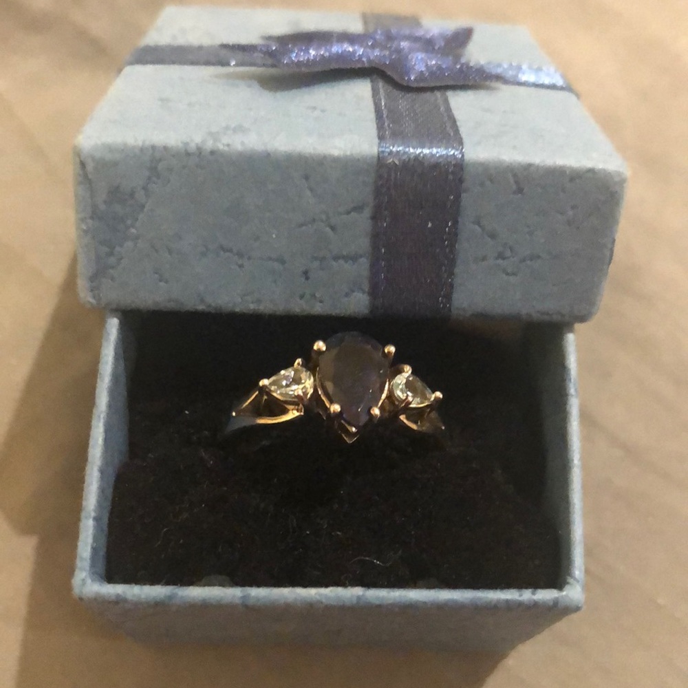 Silver ring size 7 1/2 with sapphire and cz’s